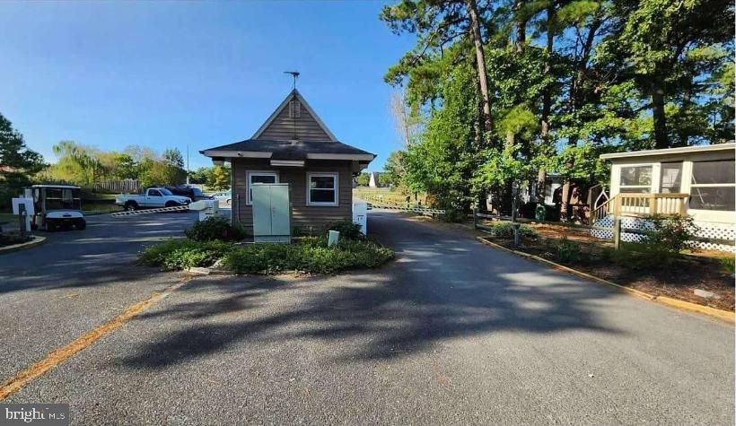 111 Beach Harbor Road Grasonville, MD 21638 - Photo 11 of 15 a front view of a house with garden