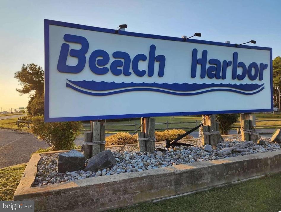 111 Beach Harbor Road Grasonville, MD 21638 - Photo 14 of 15 a sign that is on the side of a building