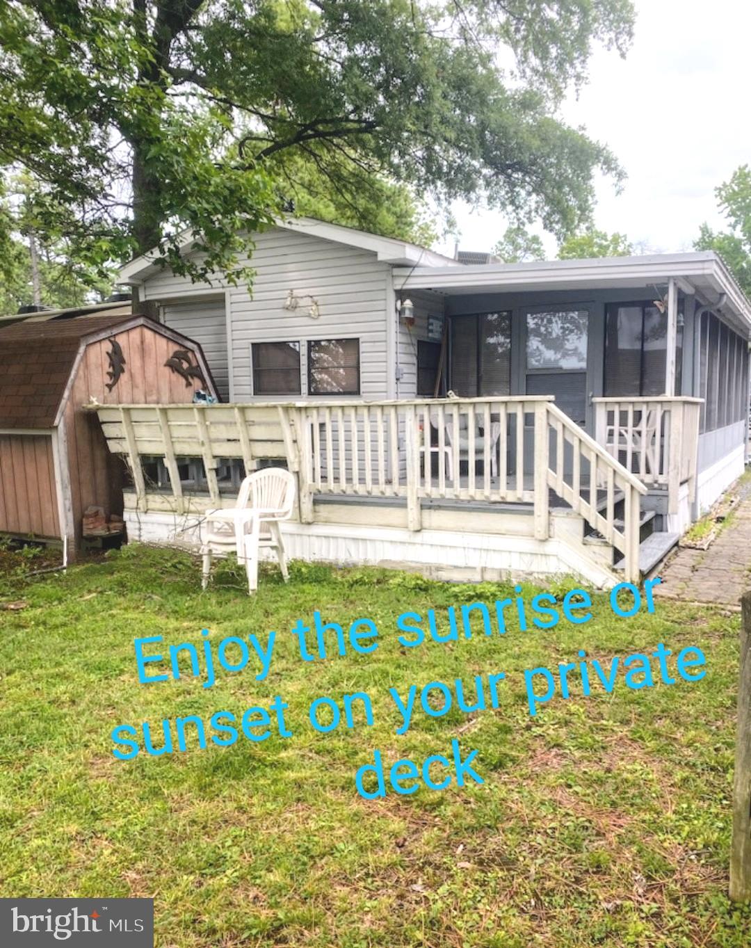 111 Beach Harbor Road Grasonville, MD 21638 - Photo 2 of 15 a front view of a house with a garden and deck