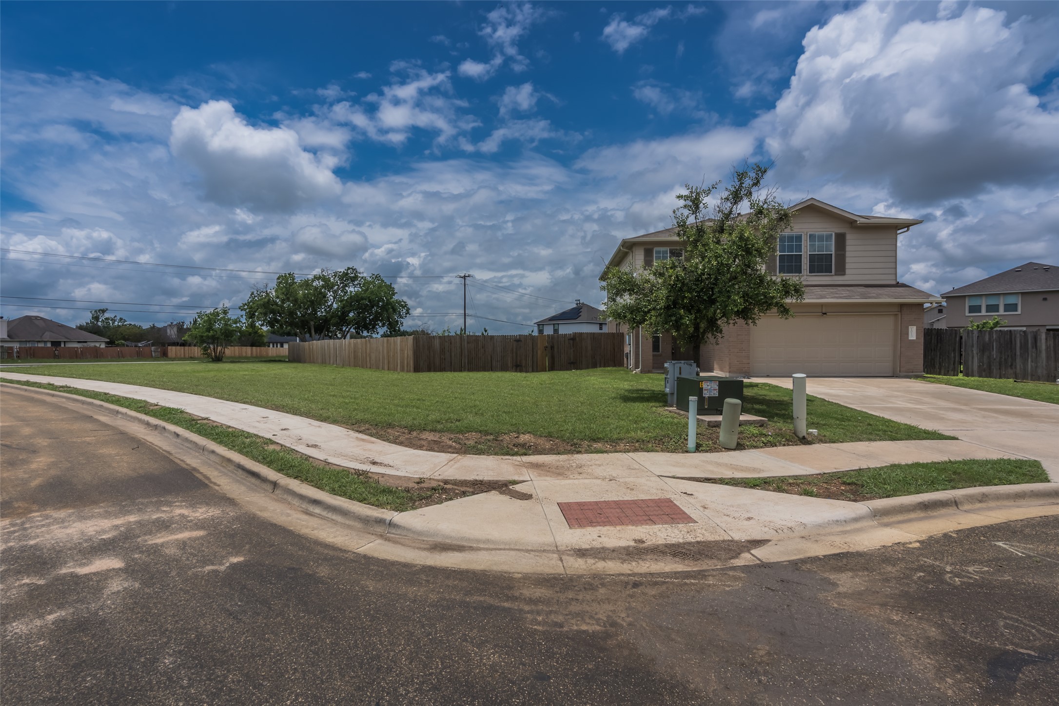 1013 Ranchero Road Leander, TX 78641 - Photo 26 of 30 A spacious corner lot presents a two-story home framed by a manicured lawn.