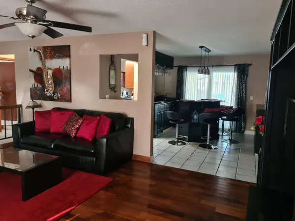 a bed sitting in a room next to a window