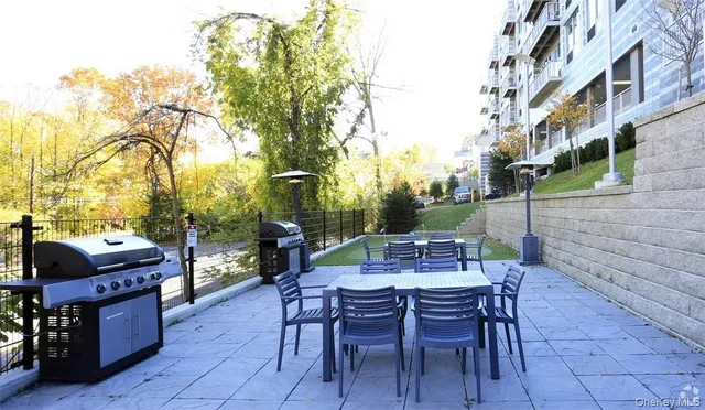 a view of a tables and chairs in a patio
