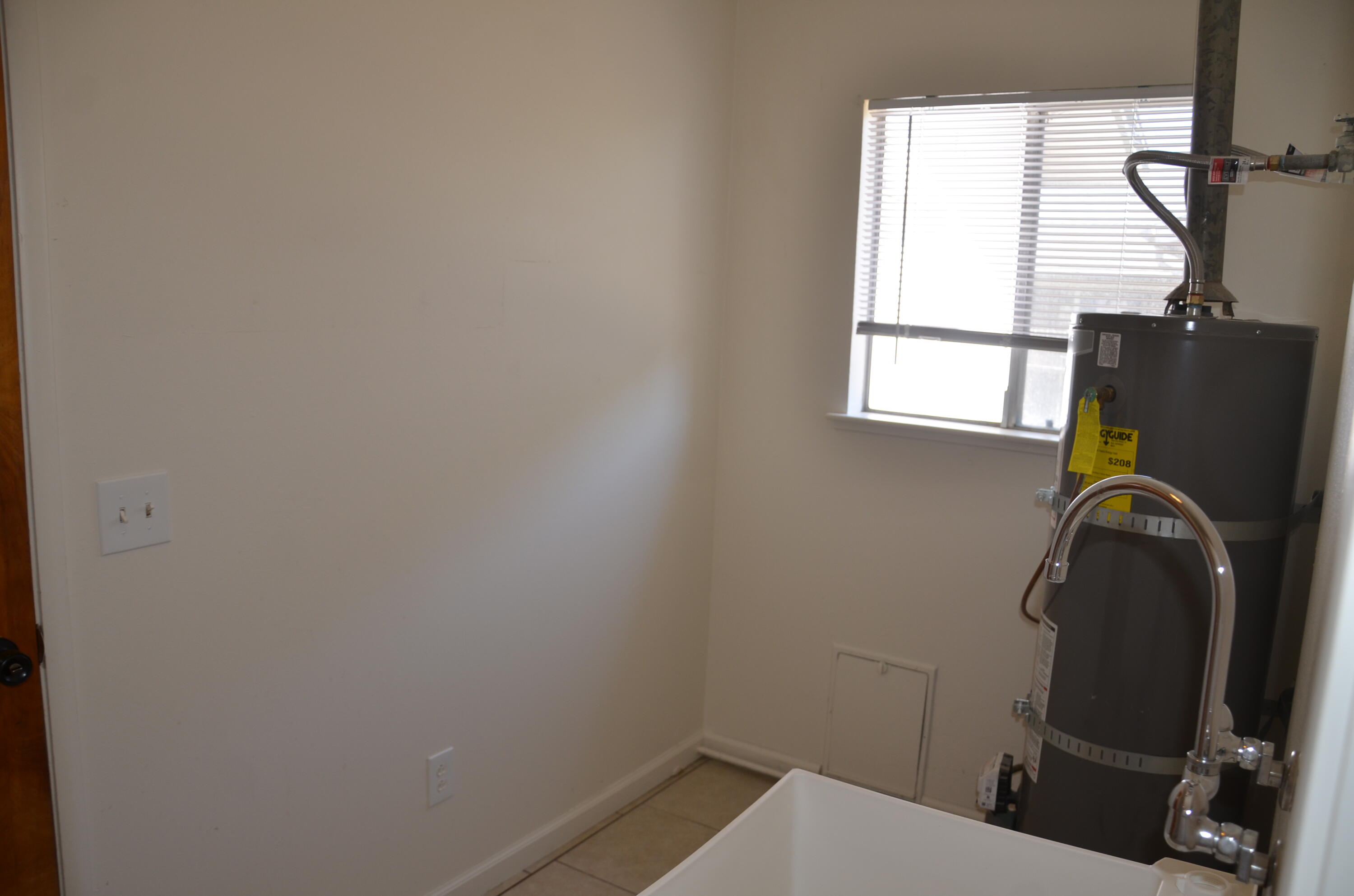339 West Spring Lane Lemoore, CA 93245 - Photo 11 of 31 a bathroom with a sink toilet and window