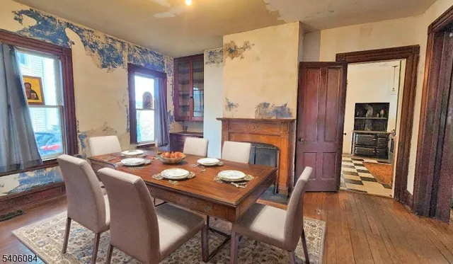 a dining room with furniture and window
