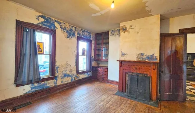 a view of livingroom with furniture and a fireplace