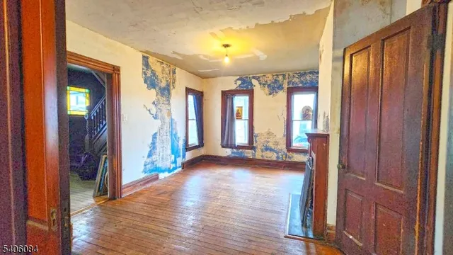 a view of a hallway with furniture and window