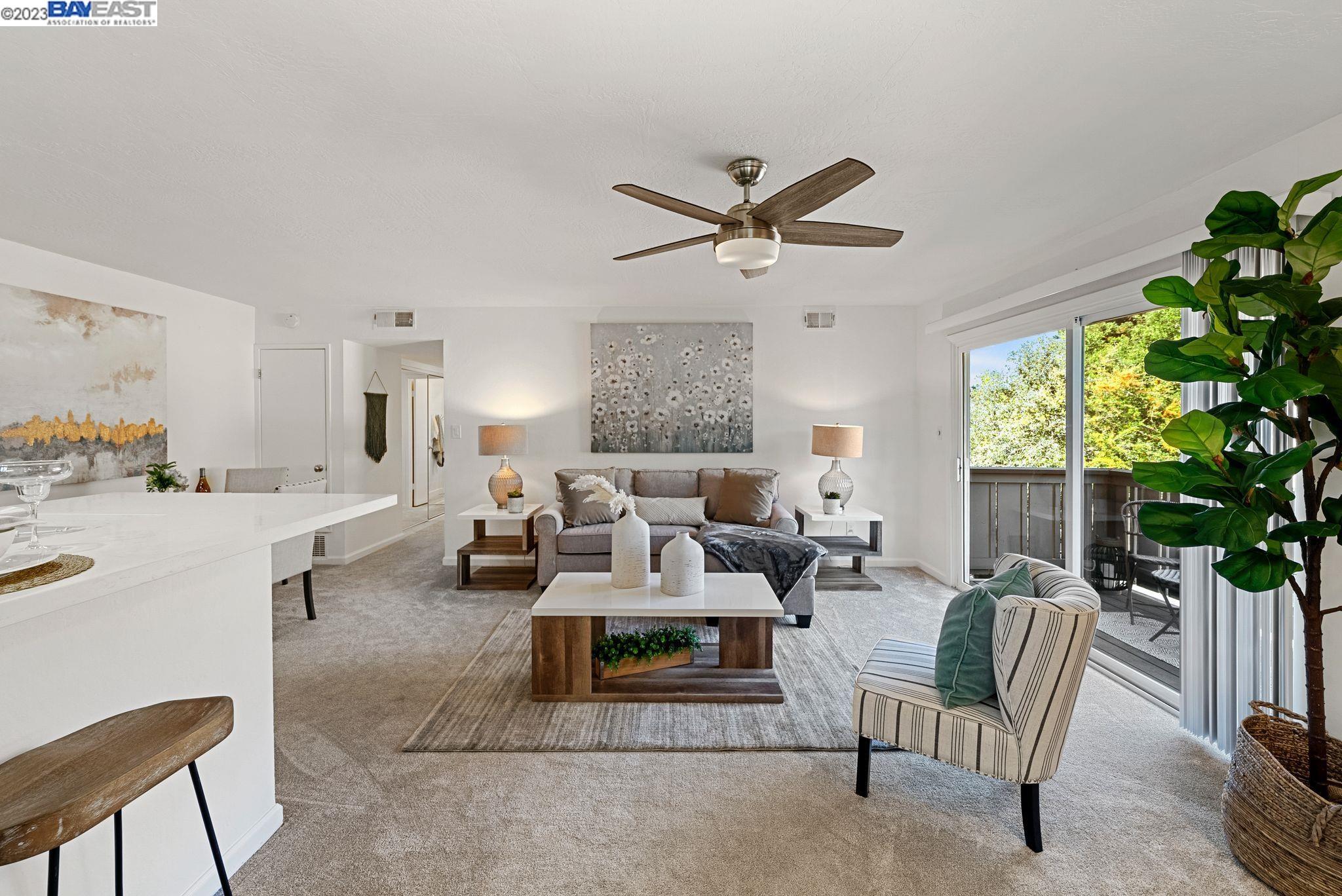 820 Villa Lane, Unit 4 Moraga, CA 94556 - Photo 1 of 1 a living room with furniture a potted plant and a large window