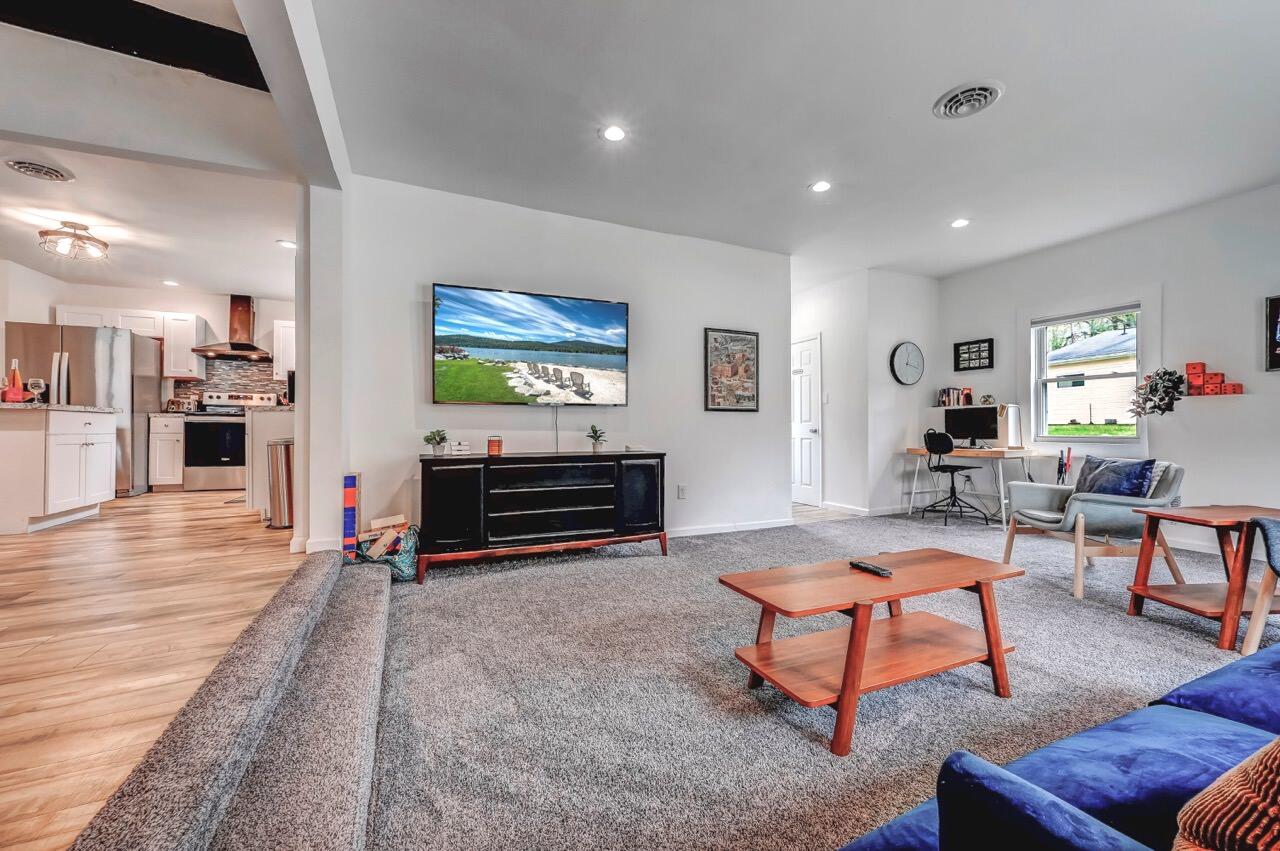 134 Altemose Road Pocono Lake, PA 18347 - Photo 12 of 48 a living room with furniture a piano and a flat screen tv
