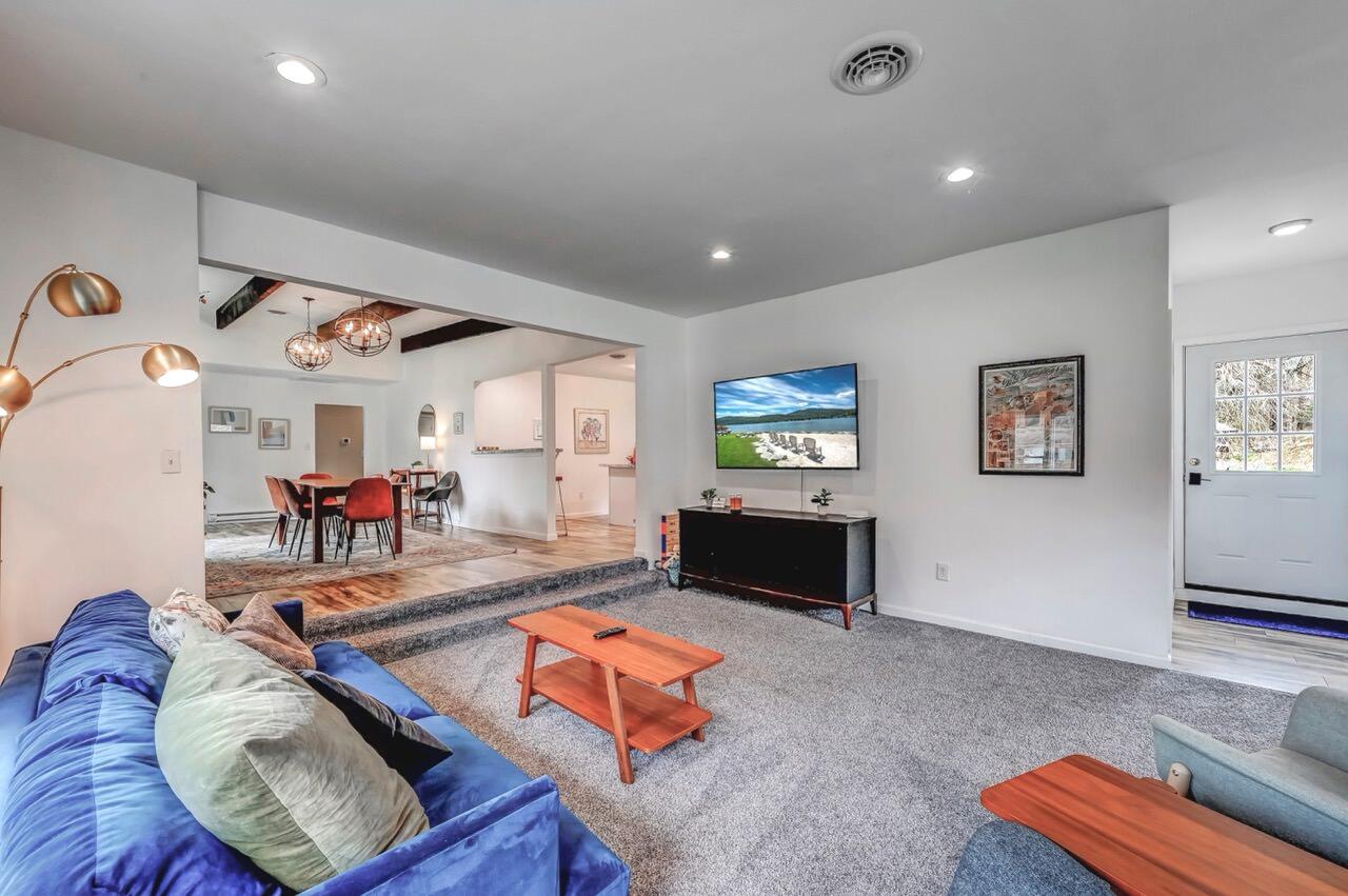 134 Altemose Road Pocono Lake, PA 18347 - Photo 13 of 48 a living room with furniture and a flat screen tv