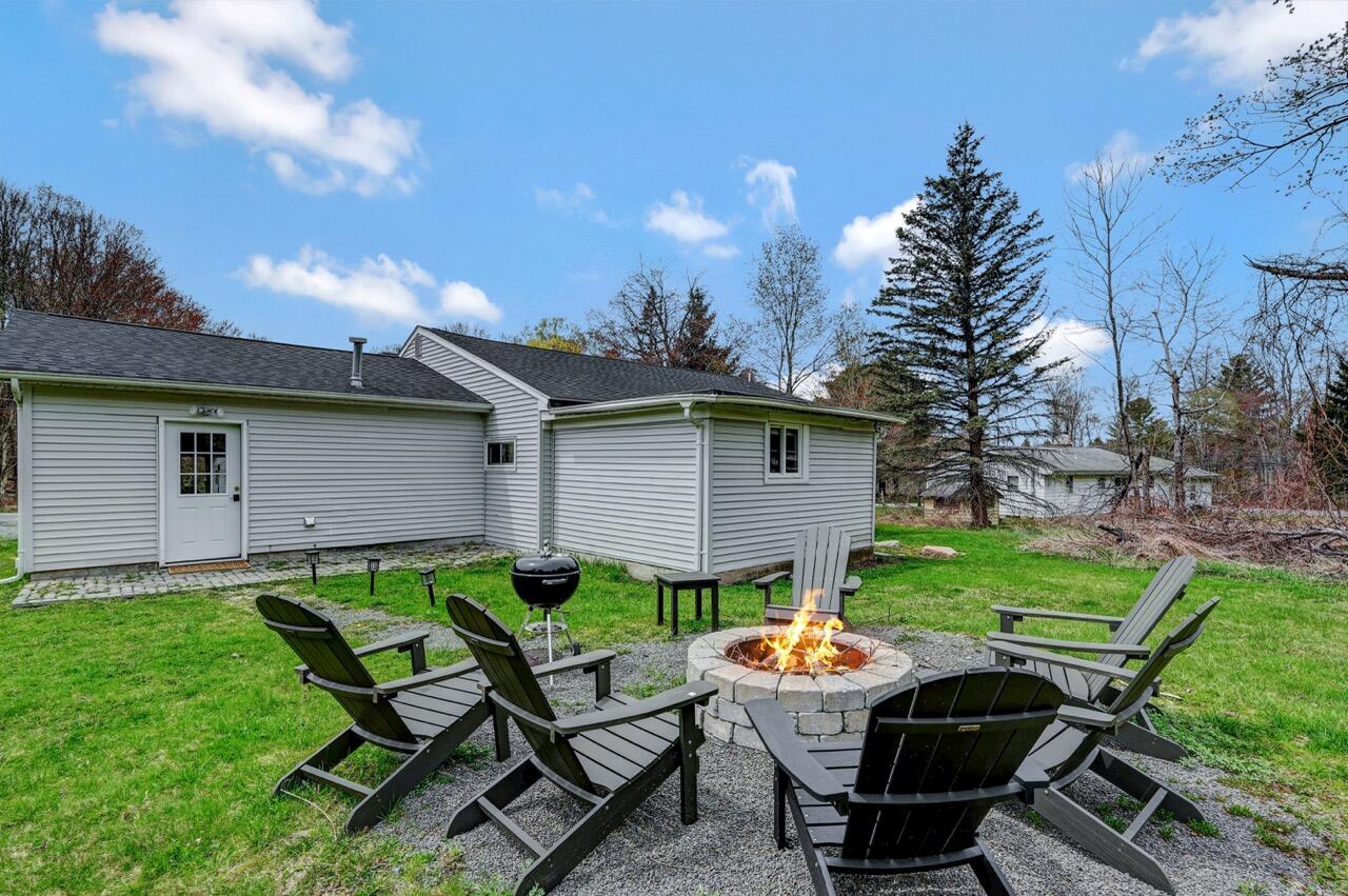 134 Altemose Road Pocono Lake, PA 18347 - Photo 2 of 48 a view of backyard with outdoor seating and green space