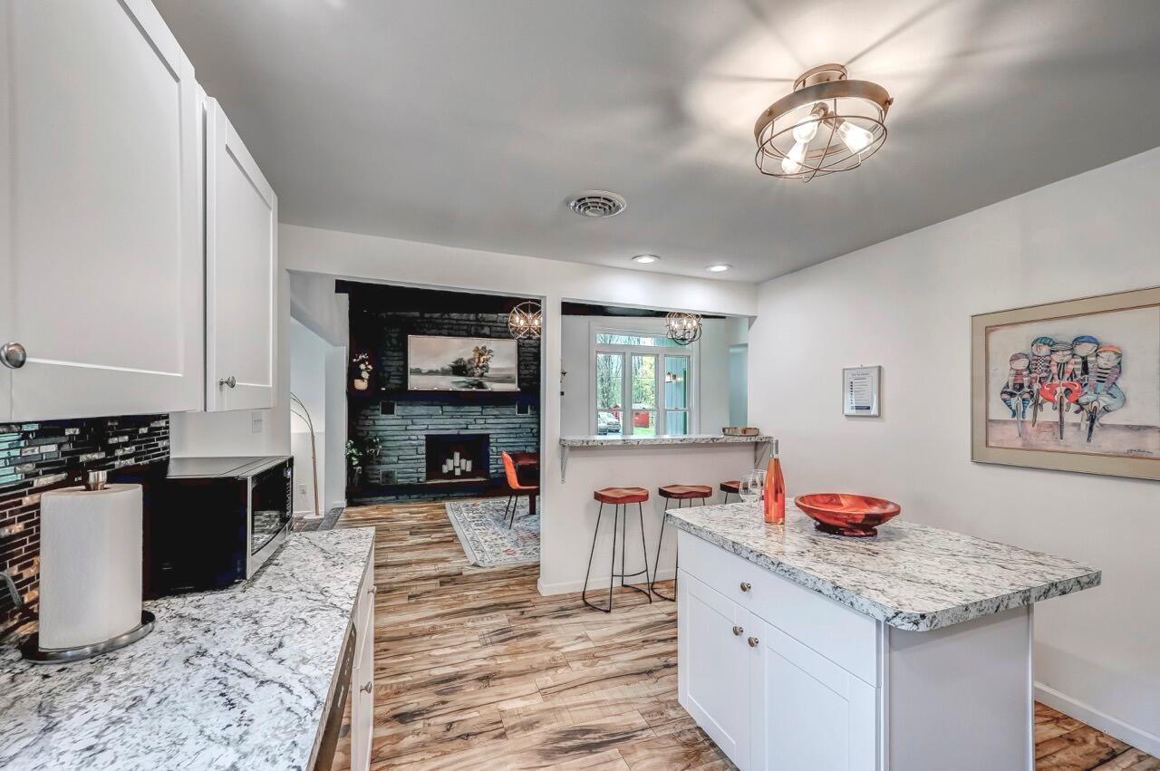 134 Altemose Road Pocono Lake, PA 18347 - Photo 20 of 48 a open kitchen with stainless steel appliances granite countertop a stove refrigerator and cabinets