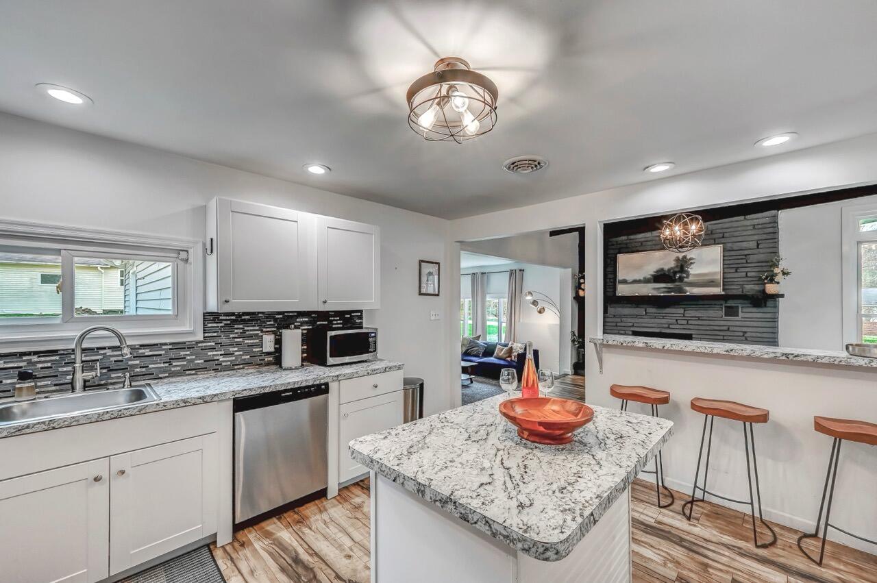 134 Altemose Road Pocono Lake, PA 18347 - Photo 21 of 48 a kitchen with stainless steel appliances granite countertop a sink and a white cabinets