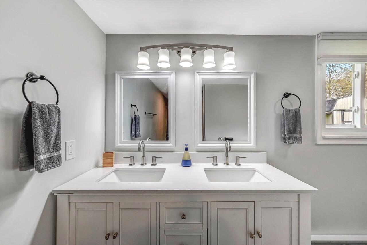 134 Altemose Road Pocono Lake, PA 18347 - Photo 31 of 48 a bathroom with a sink double vanity and a mirror