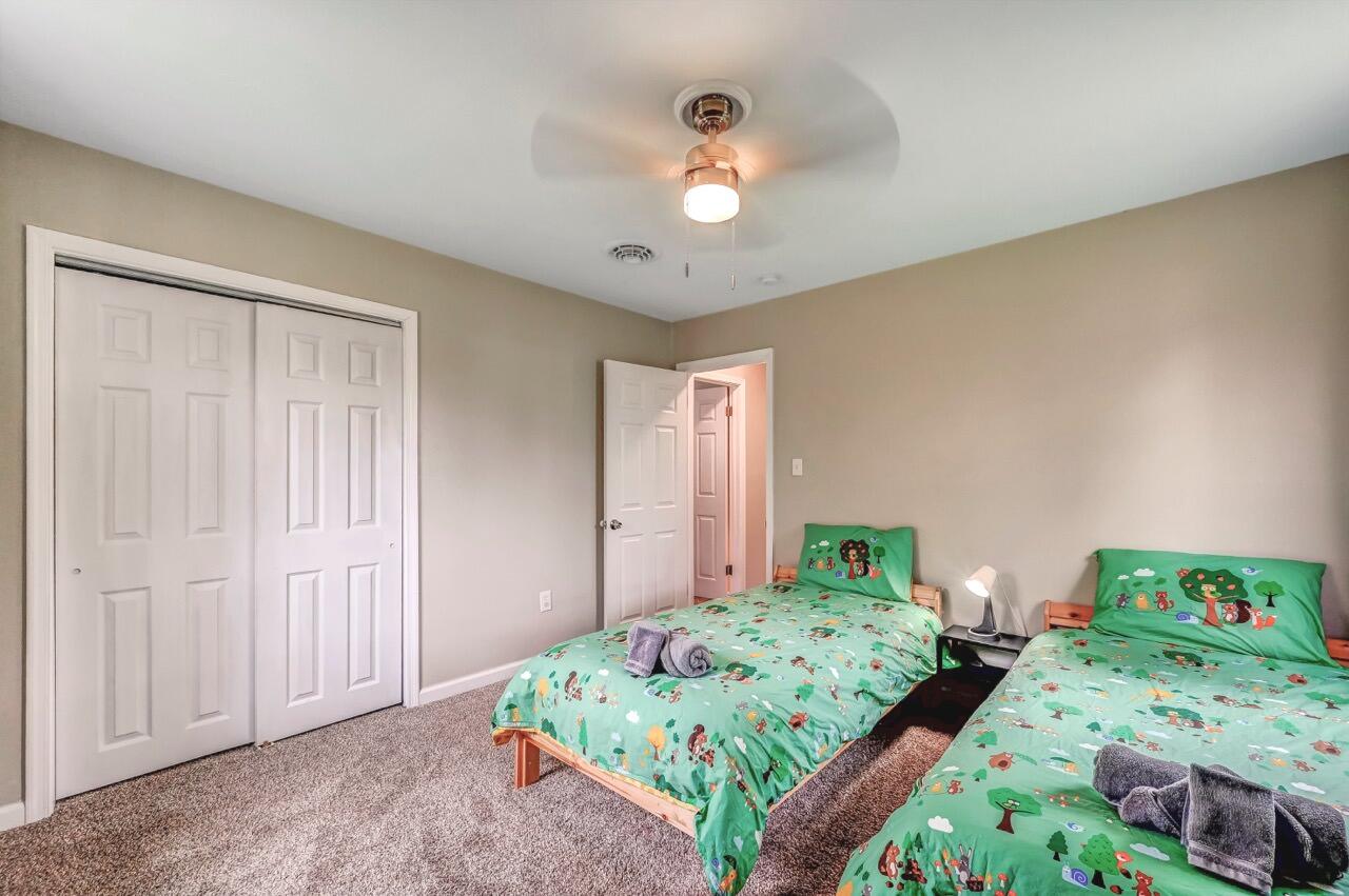 134 Altemose Road Pocono Lake, PA 18347 - Photo 35 of 48 a bedroom with bed and two windows