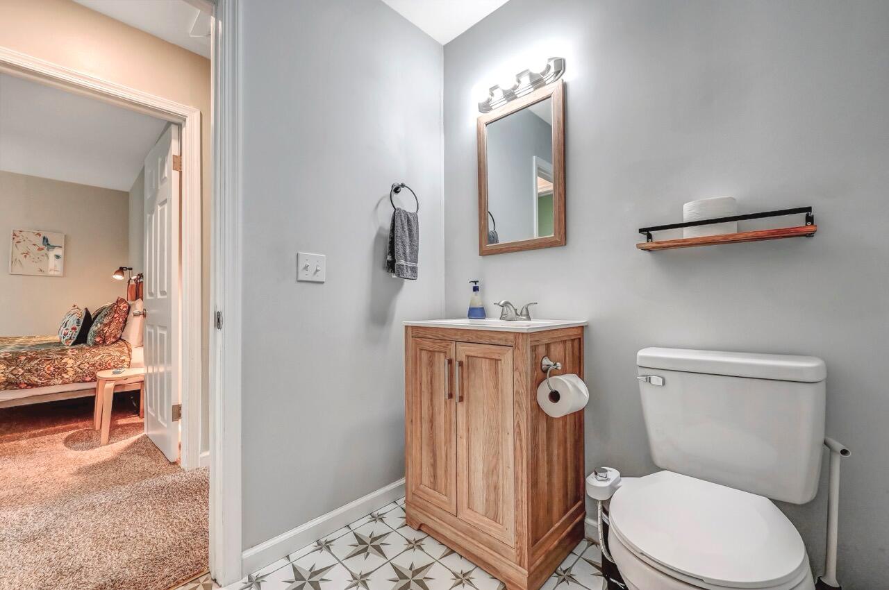 134 Altemose Road Pocono Lake, PA 18347 - Photo 37 of 48 a bathroom with a toilet a sink and mirror