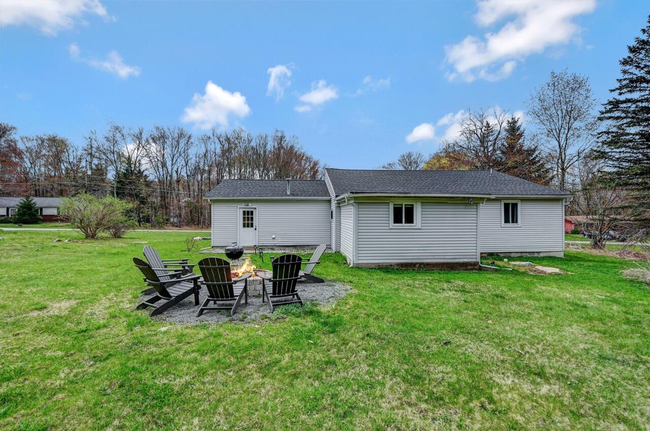 134 Altemose Road Pocono Lake, PA 18347 - Photo 44 of 48 a view of a house with backyard sitting area and garden