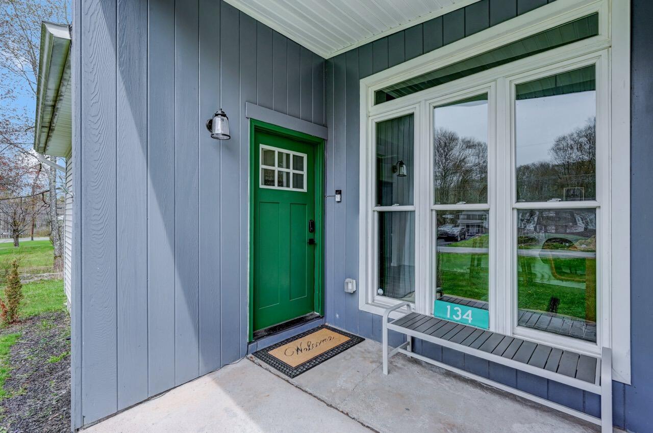 134 Altemose Road Pocono Lake, PA 18347 - Photo 4 of 48 a backyard of a house with outdoor seating and plants