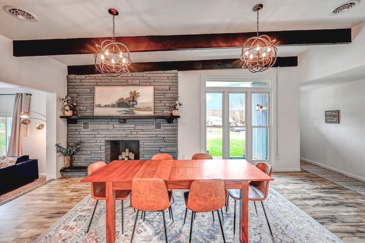 134 Altemose Road Pocono Lake, PA 18347 - Photo 9 of 48 a view of a dining room with furniture wooden floor and chandelier