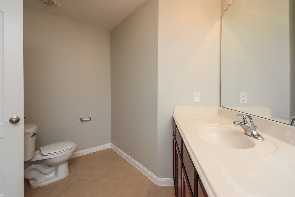 2131 Golden Topaz Drive Rosharon, TX 77583 - Photo 12 of 16 a bathroom with a sink toilet and vanity