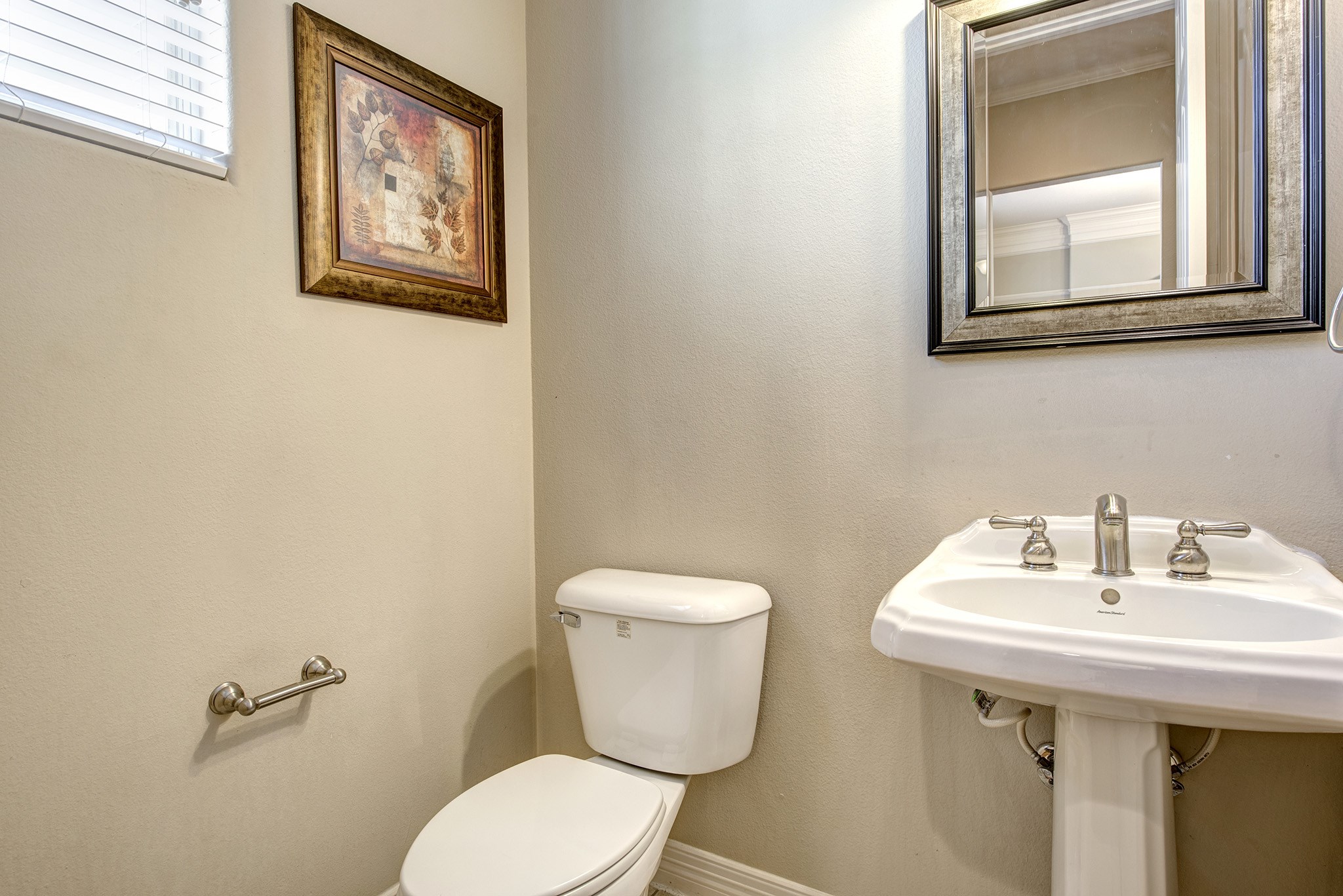4003 Feagan Street, Unit 2 Houston, TX 77007 - Photo 14 of 25 a bathroom with a toilet a sink and mirror
