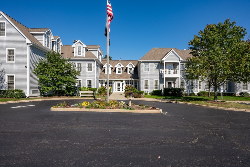 7 Assinippi Avenue, Unit 213 Norwell, MA 02061 - Photo 1 of 26 a aerial view of a house with a big yard and potted plants