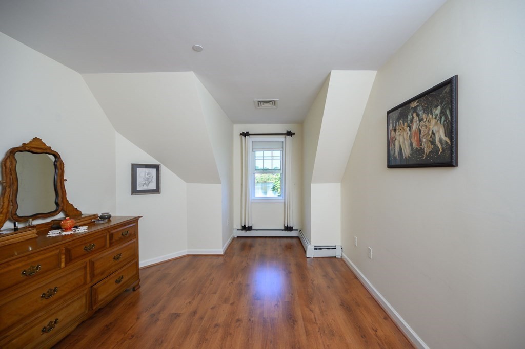 7 Assinippi Avenue, Unit 213 Norwell, MA 02061 - Photo 12 of 26 a view of room with window and wooden floor