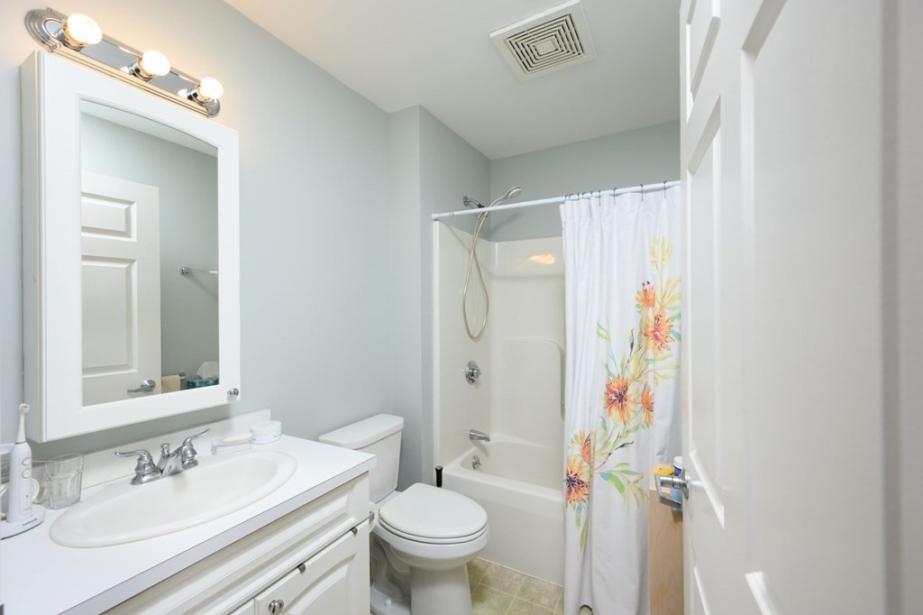 7 Assinippi Avenue, Unit 213 Norwell, MA 02061 - Photo 16 of 26 a bathroom with a sink toilet and shower