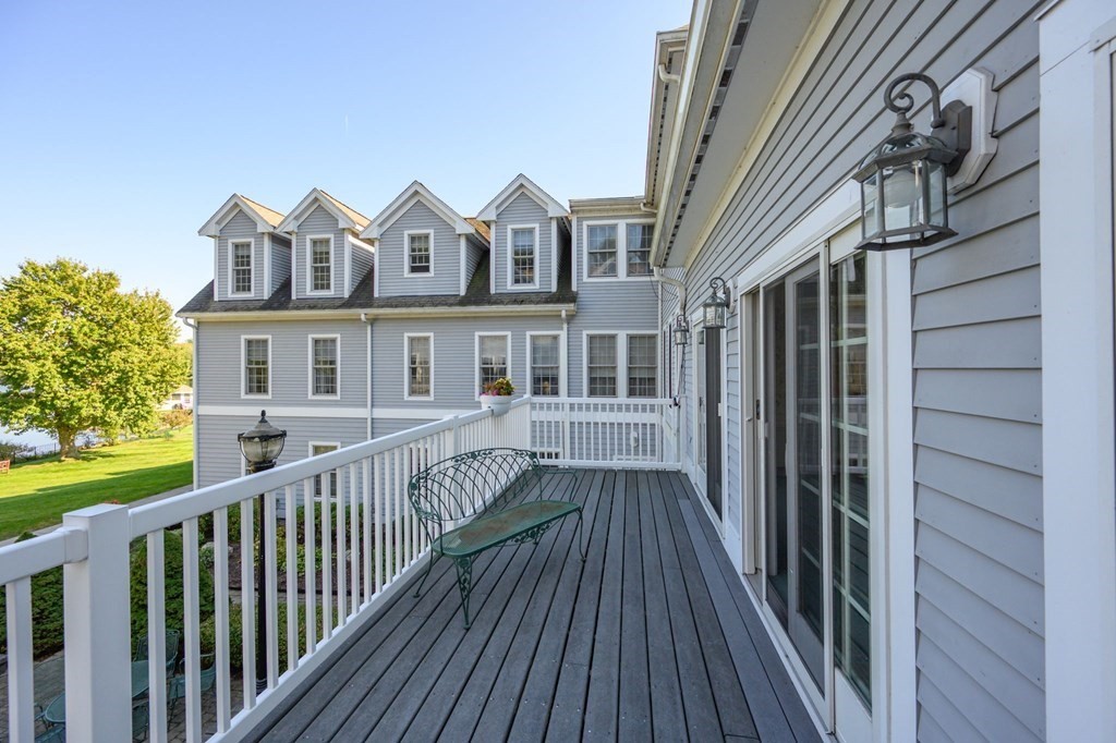 7 Assinippi Avenue, Unit 213 Norwell, MA 02061 - Photo 19 of 26 a view of a house with a deck