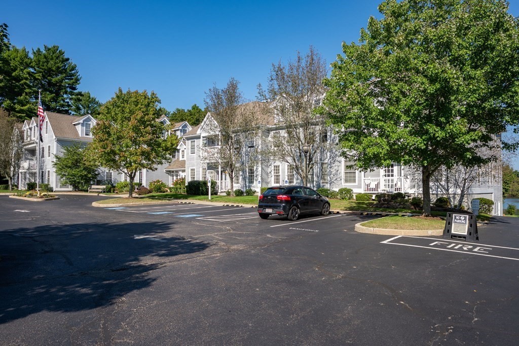 7 Assinippi Avenue, Unit 213 Norwell, MA 02061 - Photo 24 of 26 a view of street with parked cars