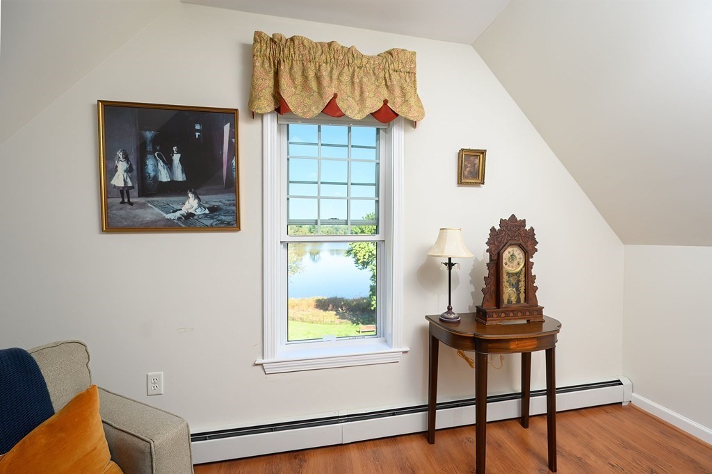 7 Assinippi Avenue, Unit 213 Norwell, MA 02061 - Photo 5 of 26 a view of a workspace room with furniture and wooden floor