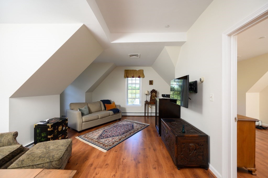 7 Assinippi Avenue, Unit 213 Norwell, MA 02061 - Photo 7 of 26 a living room with furniture and a couch