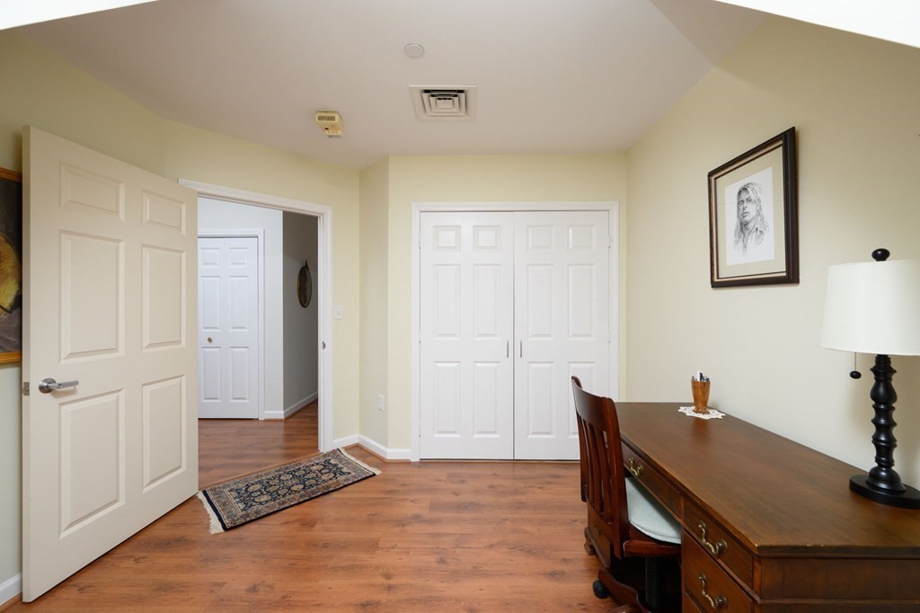 7 Assinippi Avenue, Unit 213 Norwell, MA 02061 - Photo 9 of 26 a view of a workspace with furniture and a window
