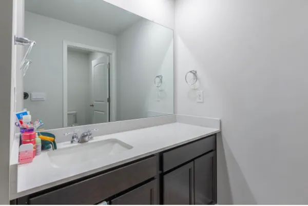 a bathroom with a sink and a mirror