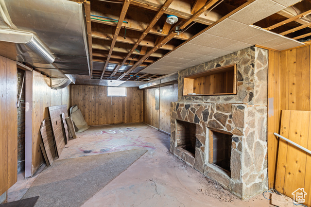 465 North Main Street Richfield, UT 84701 - Photo 36 of 43 Below grade area featuring a stone fireplace and wood walls