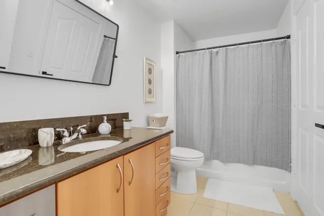 a bath room with sink and a mirror