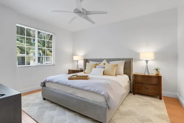 a bedroom with bed and window