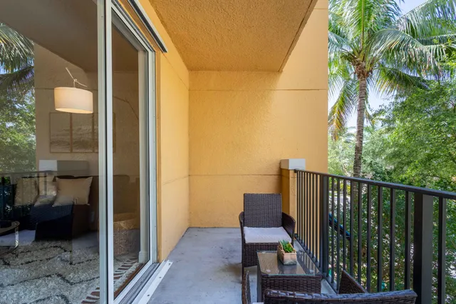 a view of balcony with furniture