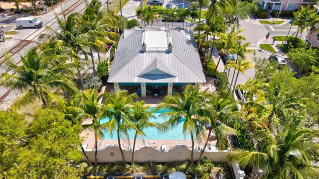 a front view of a house with yard and trees