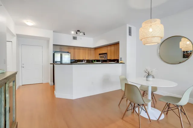 a view of kitchen and dining area with chandelier