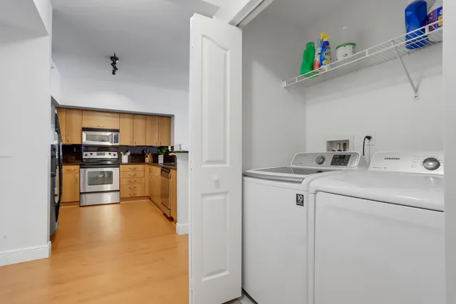 a view of storage and utility room with washer and dryer
