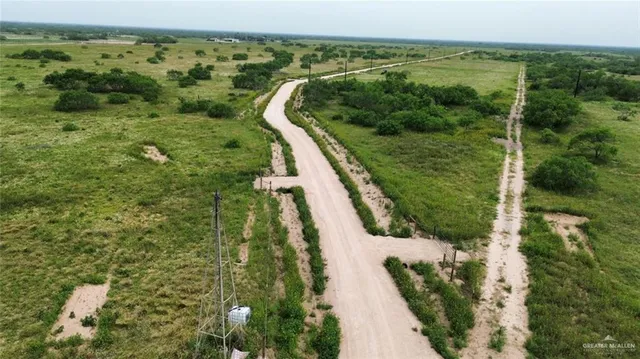 a view of a yard with an outdoor seating