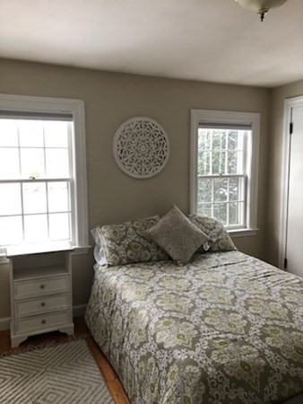 138 Highgate Street Needham, MA 02492 - Photo 13 of 17 a bedroom with a bed and a window