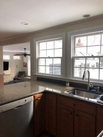 138 Highgate Street Needham, MA 02492 - Photo 5 of 17 a kitchen with granite countertop a sink and a window