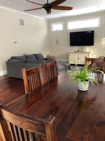 138 Highgate Street Needham, MA 02492 - Photo 8 of 17 a living room with furniture and a flat screen tv