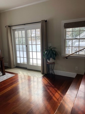 138 Highgate Street Needham, MA 02492 - Photo 9 of 17 a view of a livingroom with a furniture and a window