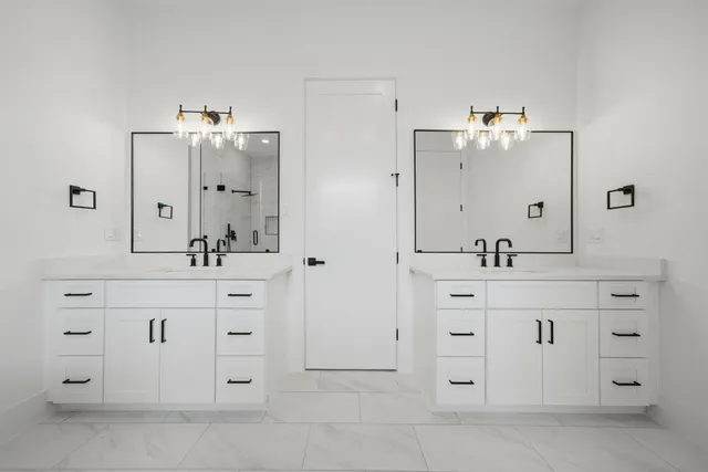 a bathroom with a sink vanity and mirror