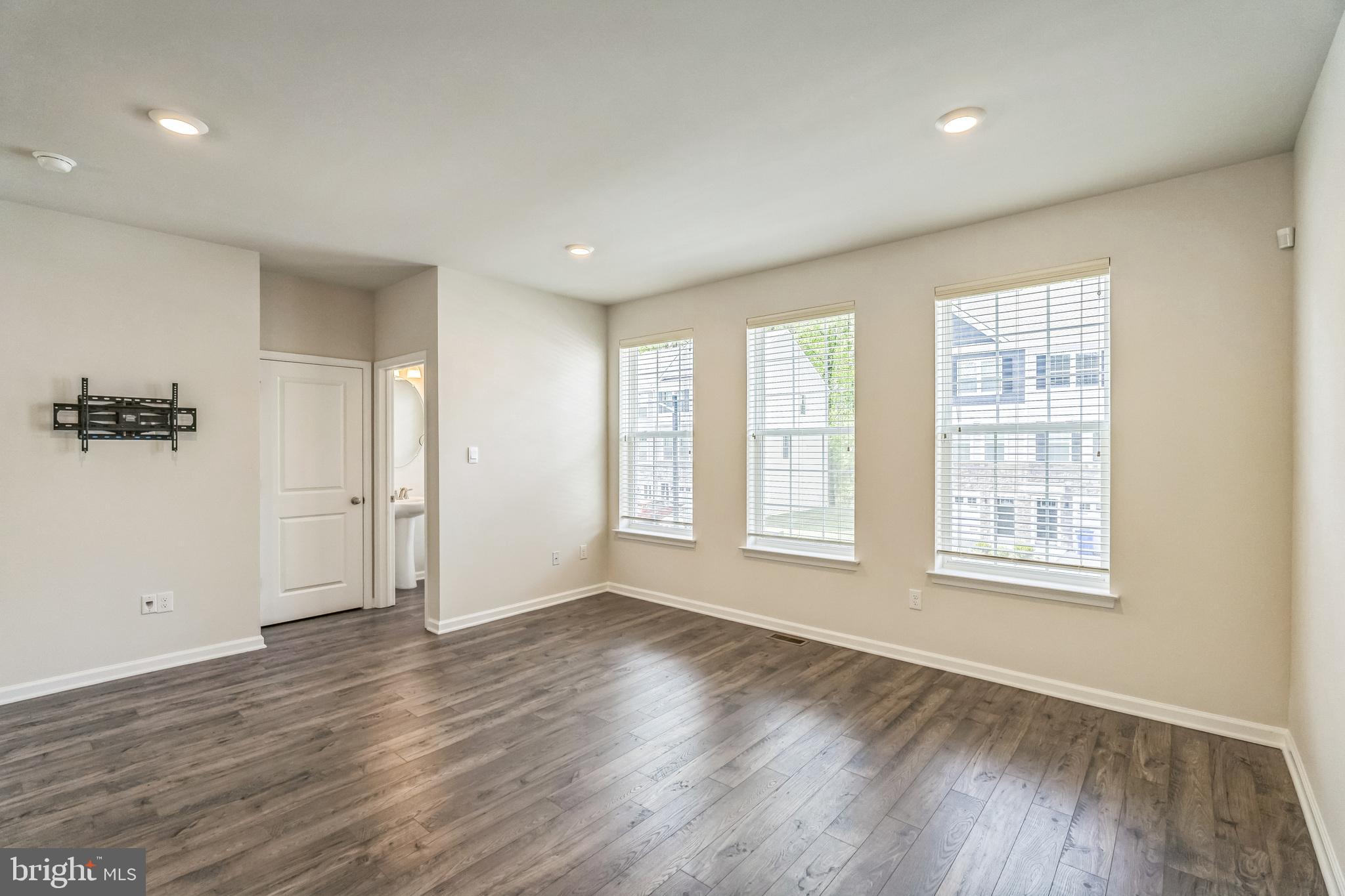 11 Lilac Circle Mount Laurel, NJ 08054 - Photo 11 of 43 an empty room with wooden floor and windows