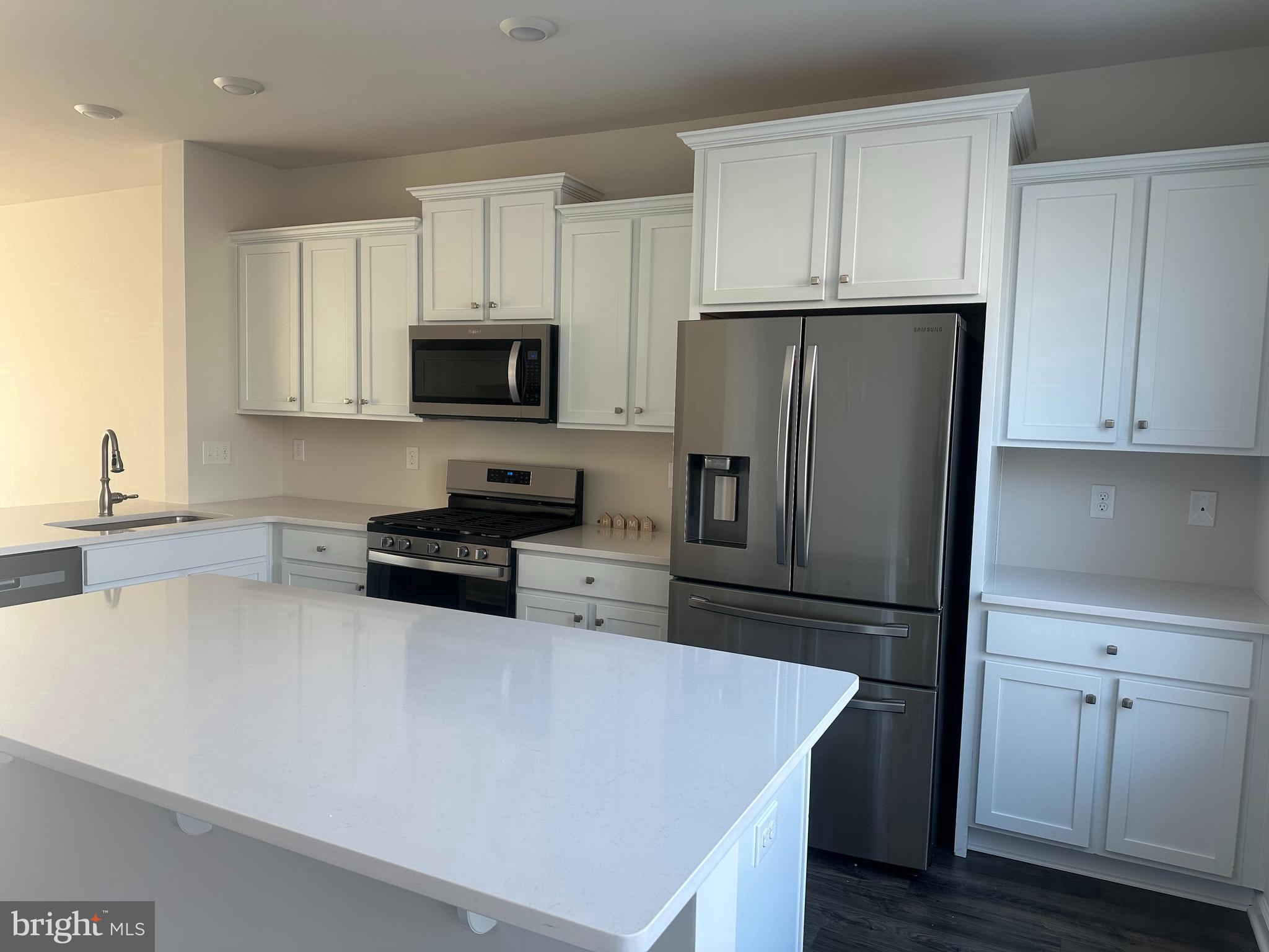 11 Lilac Circle Mount Laurel, NJ 08054 - Photo 13 of 43 a kitchen with granite countertop white cabinets and stainless steel appliances