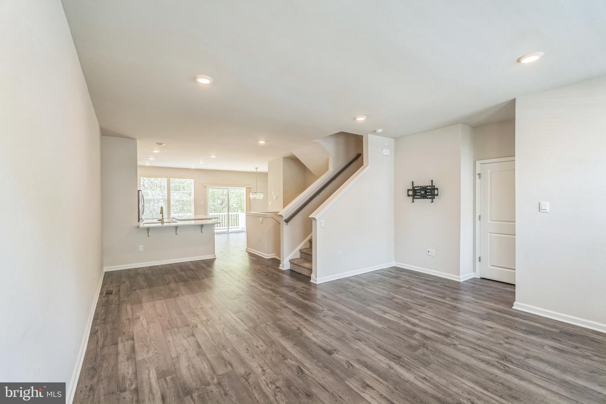 11 Lilac Circle Mount Laurel, NJ 08054 - Photo 14 of 43 a view of empty room with wooden floor and stairs