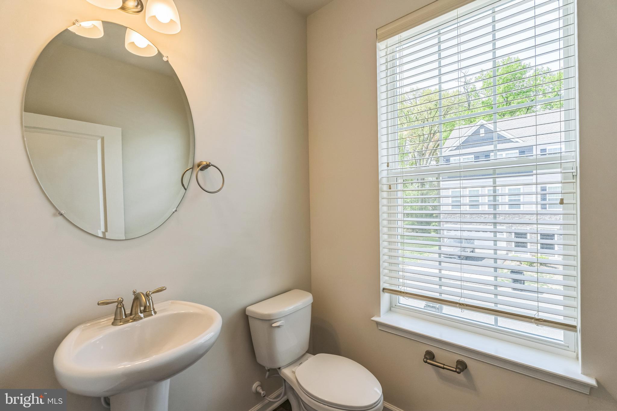 11 Lilac Circle Mount Laurel, NJ 08054 - Photo 17 of 43 a bathroom with a toilet a sink and a mirror